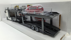 Mercedes Actros 2545 white Car transport with Ford Focus Turnier, Burago 1:43