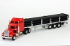 Kenworth W900 Aerocab with Flatbed Trailer and Pipe Load 