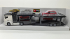 Mercedes Actros 2545 white Car transport with Ford Focus Turnier, Burago 1:43
